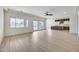 Open-concept living area boasting sleek flooring, natural light, and access to the patio at 14687 N 73Rd Dr, Peoria, AZ 85381