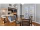 The dining area has outdoor access and is adjacent to a modern kitchen with an island and stainless appliances at 15221 N Clubgate Dr # 2059, Scottsdale, AZ 85254