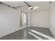 Well-lit garage interior with a sealed floor, offering ample room for parking and storage at 15221 N Clubgate Dr # 2059, Scottsdale, AZ 85254