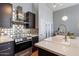 Gourmet kitchen with stainless steel appliances, tile backsplash, and breakfast bar at 15221 N Clubgate Dr # 2059, Scottsdale, AZ 85254
