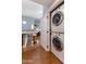 Convenient laundry area with stacked washer and dryer, adjacent to the kitchen and open living space at 15221 N Clubgate Dr # 2059, Scottsdale, AZ 85254
