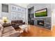 Cozy living room with hardwood floors, fireplace, wet bar and lots of natural light at 15221 N Clubgate Dr # 2059, Scottsdale, AZ 85254