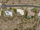 An aerial view shows luxury homes and pools with mountain views, nestled in the desert landscape at 15816 E Eagle Crest Rd, Fountain Hills, AZ 85268