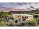 An aerial view of the home's backyard oasis featuring desert landscaping and mountain views in the background at 15816 E Eagle Crest Rd, Fountain Hills, AZ 85268