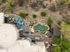 An aerial view of a desert estate with a stunning pool, patio, and landscaped grounds showcasing luxury outdoor living at 15816 E Eagle Crest Rd, Fountain Hills, AZ 85268