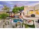 A landscaped backyard with a custom pool, hot tub, and pergola, perfect for outdoor living and entertainment at 15816 E Eagle Crest Rd, Fountain Hills, AZ 85268