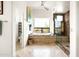 Bright bathroom with a soaking tub, natural light, decorative tile shower and backyard views at 15816 E Eagle Crest Rd, Fountain Hills, AZ 85268