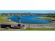 Scenic community lake view with lush landscaping and a modern cactus sculpture in Fountain Hills, Arizona at 15816 E Eagle Crest Rd, Fountain Hills, AZ 85268