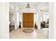 A spacious entryway featuring tile floors and a wooden double-door, leading to multiple rooms at 15816 E Eagle Crest Rd, Fountain Hills, AZ 85268