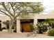 A front exterior view of a charming home with desert landscaping and trees in the yard at 15816 E Eagle Crest Rd, Fountain Hills, AZ 85268