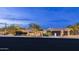 A front view of the property showcasing desert landscaping and an attached two-car garage at 15816 E Eagle Crest Rd, Fountain Hills, AZ 85268