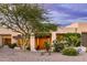 Exterior shot of a house with desert landscaping, a gravel yard, and trees near the entryway at 15816 E Eagle Crest Rd, Fountain Hills, AZ 85268
