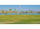 Scenic view of fountain and lake against mountain backdrop with lush grassy foreground at 15816 E Eagle Crest Rd, Fountain Hills, AZ 85268