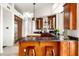 Well-appointed kitchen featuring granite countertops, a breakfast bar, and modern appliances at 15816 E Eagle Crest Rd, Fountain Hills, AZ 85268