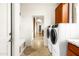 Functional laundry room equipped with modern washer/dryer units and cabinetry, maximizing utility and convenience at 15816 E Eagle Crest Rd, Fountain Hills, AZ 85268