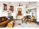 Open living room with a fireplace and tiled floors, offers a warm and inviting space at 15816 E Eagle Crest Rd, Fountain Hills, AZ 85268