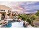 A stunning desert home with a rock-lined pool offers luxury living and beautiful views of the surrounding landscape at 15816 E Eagle Crest Rd, Fountain Hills, AZ 85268