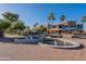 Outdoor shopping center with decorative fountains, lush landscaping and ample parking at 15816 E Eagle Crest Rd, Fountain Hills, AZ 85268