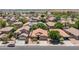 Aerial view of a suburban home featuring desert landscaping and a two-car garage at 15959 W Hearn Rd, Surprise, AZ 85379