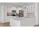 Bright kitchen featuring white cabinets, modern appliances, ample countertop space, and stylish finishes at 15959 W Hearn Rd, Surprise, AZ 85379