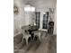 Charming dining area with a round table, stylish chandelier, and easy access to outdoor area at 1601 N Saba St # 255, Chandler, AZ 85225