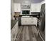 Well-maintained kitchen with granite countertops, stainless steel appliances, and ample cabinet space for storage at 1601 N Saba St # 255, Chandler, AZ 85225