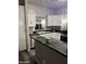 Modern kitchen featuring granite countertops, stainless steel appliances, and ample cabinetry, perfect for cooking and storage at 1601 N Saba St # 255, Chandler, AZ 85225