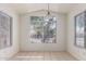 Bright dining area with tile flooring and large windows, perfect for enjoying meals at 1608 S 82Nd Dr, Phoenix, AZ 85043