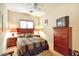 Comfortable bedroom with neutral color palette, wood furnishings, and ceiling fan at 1718 W Colter St # 126, Phoenix, AZ 85015
