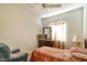 Inviting bedroom featuring soft natural lighting, ceiling fan, tv and dresser at 1718 W Colter St # 126, Phoenix, AZ 85015