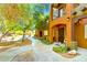 Inviting two-story condo with walkway and landscaping, with balcony and neutral desert color palette at 1718 W Colter St # 126, Phoenix, AZ 85015