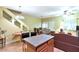 Spacious living room featuring hardwood floors, ceiling fan, and kitchen island for easy dining at 1718 W Colter St # 126, Phoenix, AZ 85015