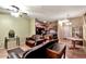 Open-concept living room featuring wood floors, ceiling fan, stylish furniture, and connected kitchen at 1718 W Colter St # 126, Phoenix, AZ 85015