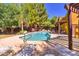 Community pool area featuring mature trees, lounge chairs, and pergolas for shade at 1718 W Colter St # 126, Phoenix, AZ 85015