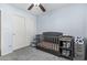This is a well-lit bedroom with a crib and a closet at 1733 N 77Th Dr, Phoenix, AZ 85035