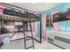 A bedroom featuring a loft bed with a desk and storage at 1733 N 77Th Dr, Phoenix, AZ 85035