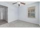 A bright bedroom with a window that lets in plenty of natural light at 1733 N 77Th Dr, Phoenix, AZ 85035