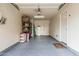 A garage with ample storage and epoxy flooring at 1733 N 77Th Dr, Phoenix, AZ 85035