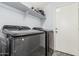This laundry room features newer appliances at 1733 N 77Th Dr, Phoenix, AZ 85035