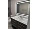Modern bathroom featuring vanity with quartz countertop, LED mirror and grey subway tile shower at 1813 E Boise St, Mesa, AZ 85203