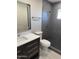 Updated bathroom with modern vanity, sleek fixtures, and tiled walk-in shower at 1813 E Boise St, Mesa, AZ 85203