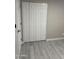 Bedroom featuring wood-look flooring and closet at 1813 E Boise St, Mesa, AZ 85203