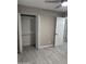 Spacious bedroom with wood-look floors and a large closet at 1813 E Boise St, Mesa, AZ 85203