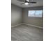 Neutral bedroom with wood-look floors and a window at 1813 E Boise St, Mesa, AZ 85203