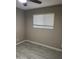 Bedroom featuring wood-look flooring and large window at 1813 E Boise St, Mesa, AZ 85203