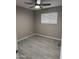 Light-filled bedroom with wood-look floors and ample natural light from a window at 1813 E Boise St, Mesa, AZ 85203