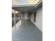 Covered patio area, offering a clean and simple outdoor space for relaxation and entertainment at 1813 E Boise St, Mesa, AZ 85203
