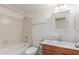 This clean bathroom features a bathtub with a shower, a toilet, and a single sink with marble countertops at 1836 N Stapley Dr # 191, Mesa, AZ 85203