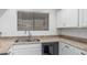 Bright kitchen features a stainless steel sink and granite countertops at 1836 N Stapley Dr # 191, Mesa, AZ 85203