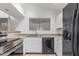 Kitchen features black appliances, white cabinets, and granite countertops at 1836 N Stapley Dr # 191, Mesa, AZ 85203